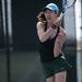 Huron No 1 singles player Isabel Zheng hits a ball as yellow fuzz floats in the air on Tuesday, May 7. Daniel Brenner I AnnArbor.com